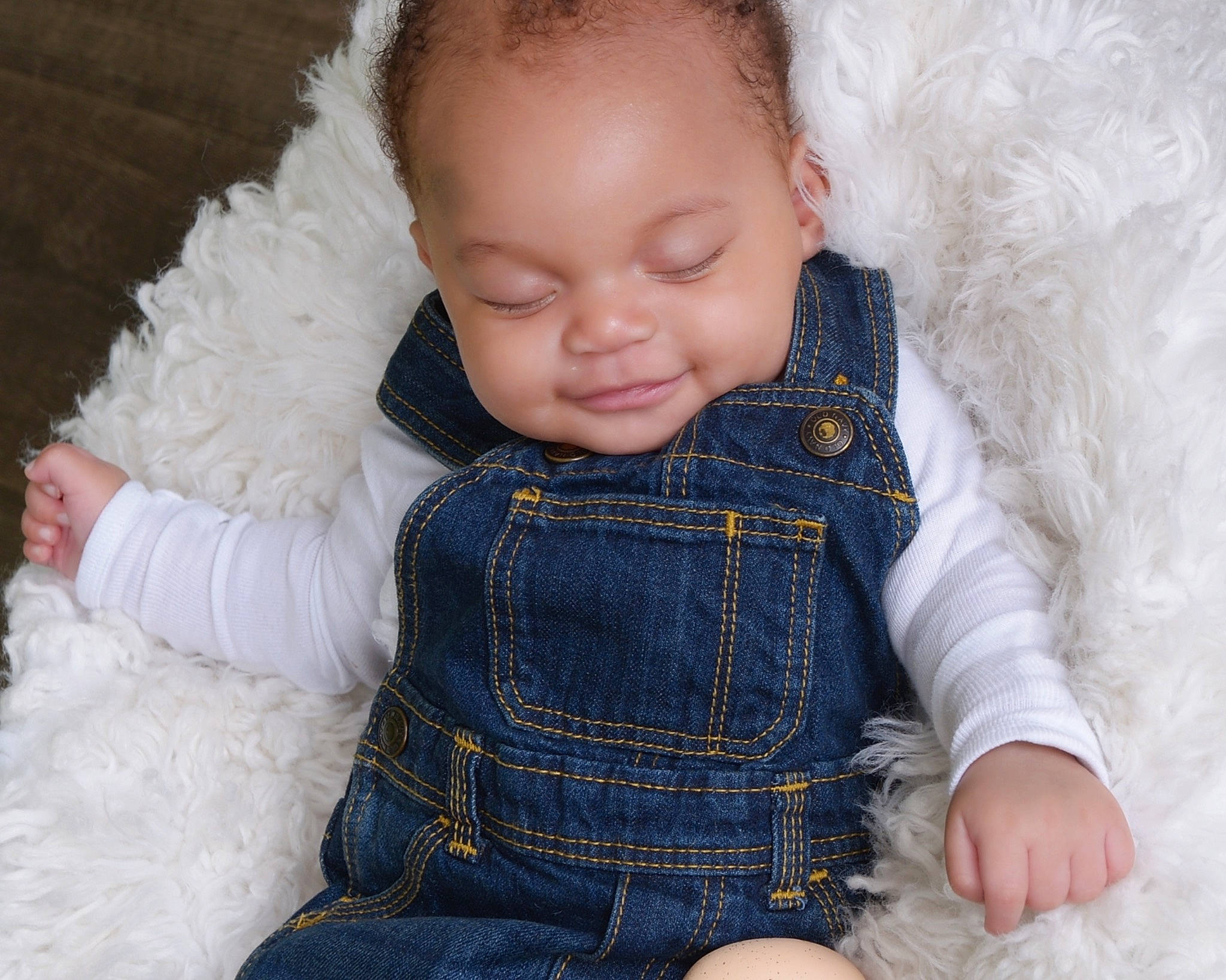 Karsen is registered to the contest to win money with this photo: baby_toddler_clothing, cheek, clothing, eye, finger, fur_clothing, hair, hand, happy, head, iris, lip, mammal, nose, organ, outerwear, person, skin, sleeve, textile