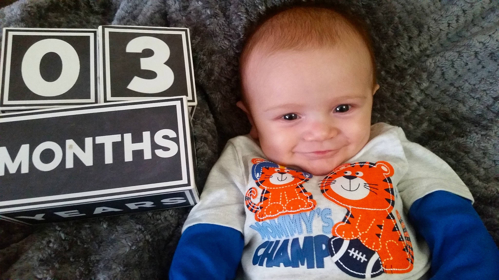 Rowan joined the competition — help win amazing prizes! baby, baby_toddler_clothing, cheek, child, cool, ear, eye, face, forehead, head, male, nose, orange, outerwear, person, product, sleeve, smile, t_shirt, toddler