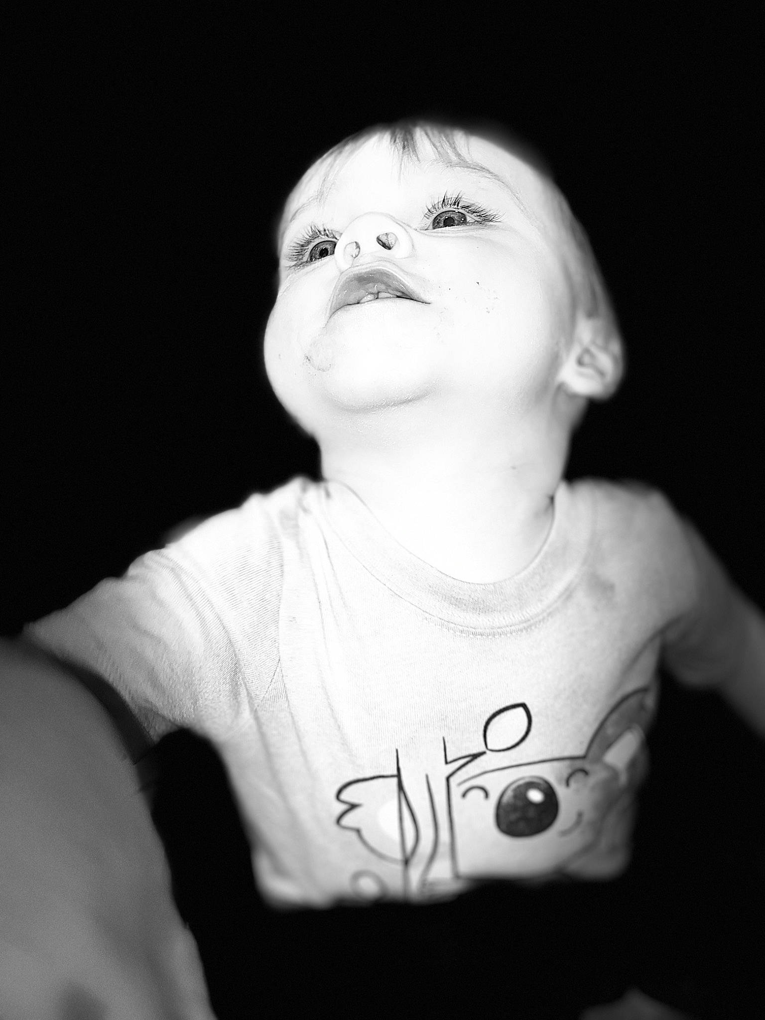 Kingston is registered to the contest to win money with this photo: black, black_and_white, cheek, child, chin, cool, eye, face, facial_expression, head, lip, monochrome, monochrome_photography, mouth, person, photograph, photography, portrait, smile, toddler