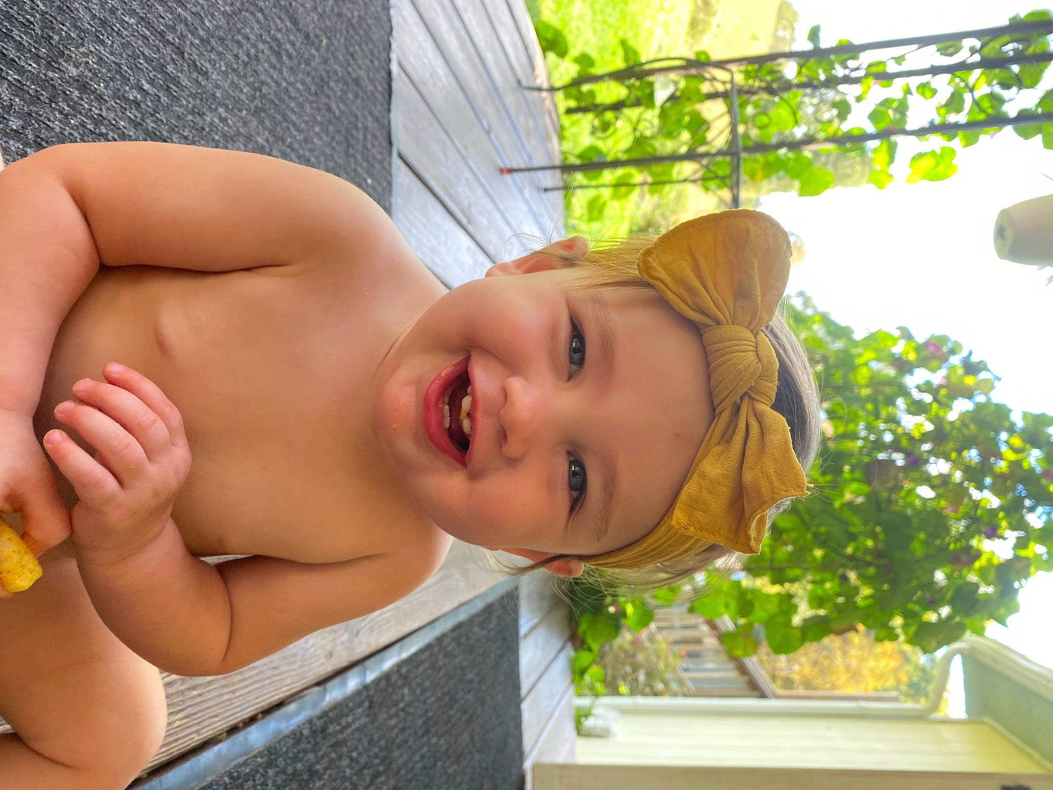 Jazlynn is registered to the contest to win money with this photo: baby, barechested, bathing, chest, child, fun, grass, happy, headwear, joy, leisure, person, plant, recreation, smile, toddler, underpants, vacation, yellow