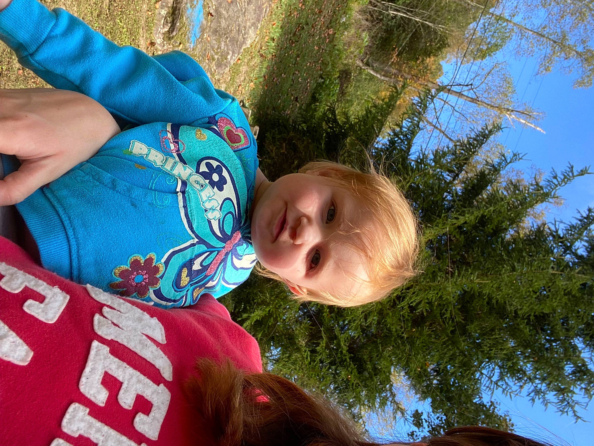 Haisley joined the competition — help win amazing prizes! child, electric_blue, fun, grass, happy, leaf, leisure, people_in_nature, person, plant, recreation, sitting, sky, smile, spring, summer, t_shirt, toddler, tree, vacation