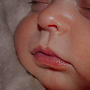 Kimberly joined the competition — help win amazing prizes! baby, close_up, sleeping, face, skin, lips, nose, cheek, eyelashes, blanket, soft_texture, peaceful, infant, child, portrait, cute, young, resting, warm_lighting, cozy