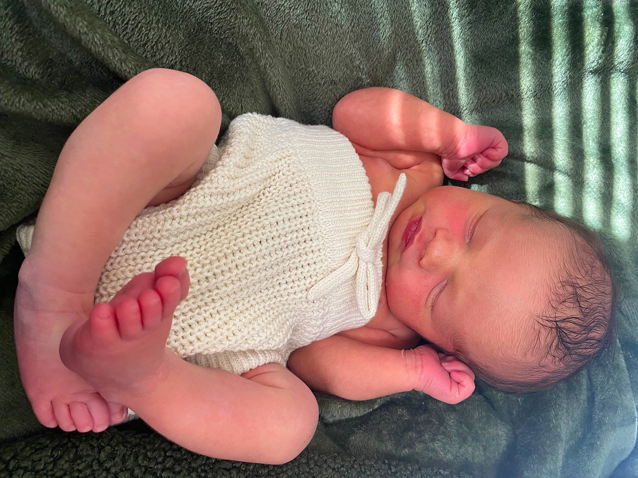 Roman is registered to the contest to win money with this photo: abdomen, baby, baby_sleeping, baby_toddler_clothing, cheek, chest, child, comfort, eyelash, finger, flesh, foot, gesture, hand, human_leg, linens, nail, person, skin, thumb