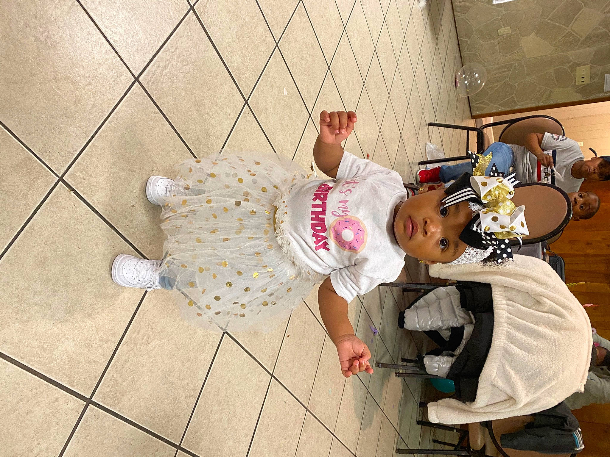 Aubrey is registered to the contest to win money with this photo: baby, baby_toddler_clothing, child, costume, floor, flooring, person, sandal, sock, toddler, walking_shoe
