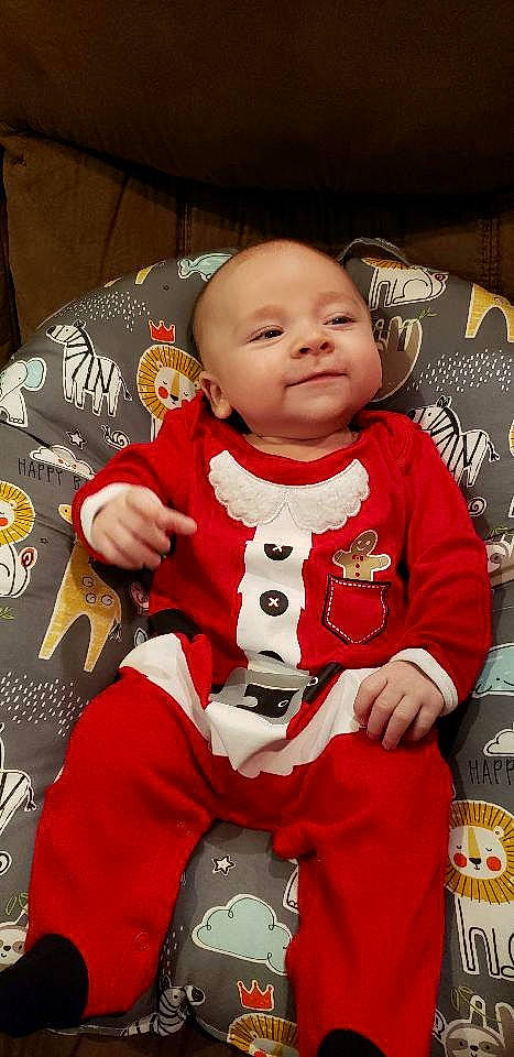 Damien is registered to the contest to win money with this photo: baby, child, christmas_eve, person, toddler