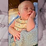 Phoenix is registered to the contest to win money with this photo: baby, sleeping, blanket, blue, hand, face, infant, cute, peaceful, resting, soft, toddler, child, indoors, portrait, cozy, clothing, wooden_floor, person, sleep
