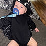 baby, bat, black_clothing, blanket, blue_eyes, child, comfort, costume, couch, cute, fabric, face, hood, indoor, infant, legs, pacifier, relaxed, soft_toys, web_wings
