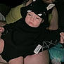 baby, bat_ears, black_clothing, casual, child, comfort, cute, hand, holding, hoodie, indoors, infant, lap, person, plush_toy, resting, skin, sleepy, soft_toy, toddler