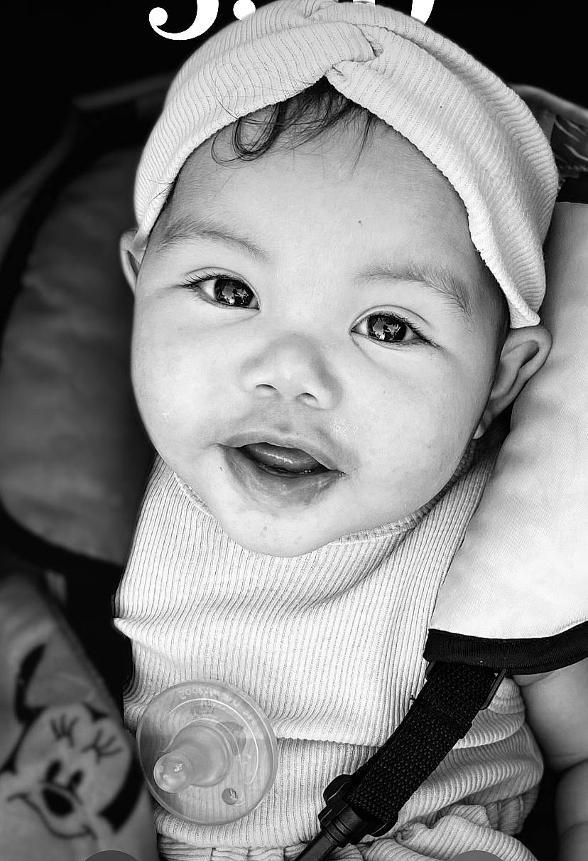 Alora is registered to the contest to win money with this photo: baby, black, black_and_white, cap, cheek, eye, eyebrow, eyelash, flash_photography, happy, hat, headgear, headwear, iris, lip, mouth, nose, person, skin, style