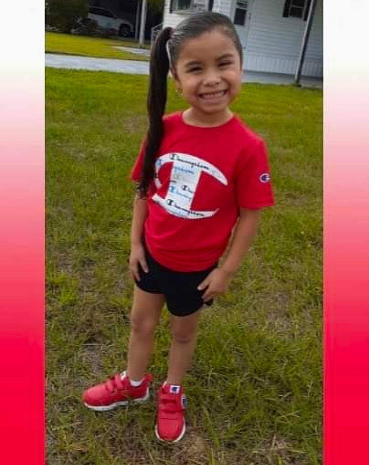 Jennifer is registered to the contest to win money with this photo: child, clothing, cool, footwear, fun, grass, happy, joy, leisure, people_in_nature, person, pink, plant, recreation, shorts, sleeve, smile, sneakers, sportswear, t_shirt