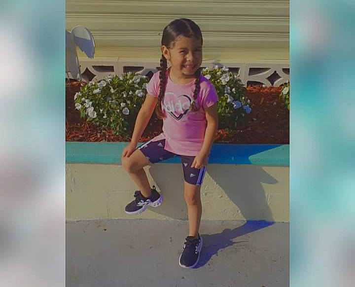 Jennifer is registered to the contest to win money with this photo: electric_blue, footwear, happy, human_leg, joy, knee, leisure, magenta, mammal, people_in_nature, person, pink, plant, shorts, smile, sneakers, summer, t_shirt, thigh, toddler