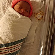 Alyssa is registered to the contest to win money with this photo: newborn, baby, hospital, blanket, bassinet, pacifier, sleeping, infant, pink_hat, wrapped, cute, child, bed, soft, new_life, peaceful, cozy, fresh, hospital_setting, resting