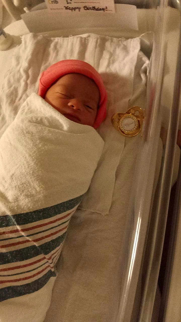 Alyssa is registered to the contest to win money with this photo: newborn, baby, hospital, blanket, bassinet, pacifier, sleeping, infant, pink_hat, wrapped, cute, child, bed, soft, new_life, peaceful, cozy, fresh, hospital_setting, resting