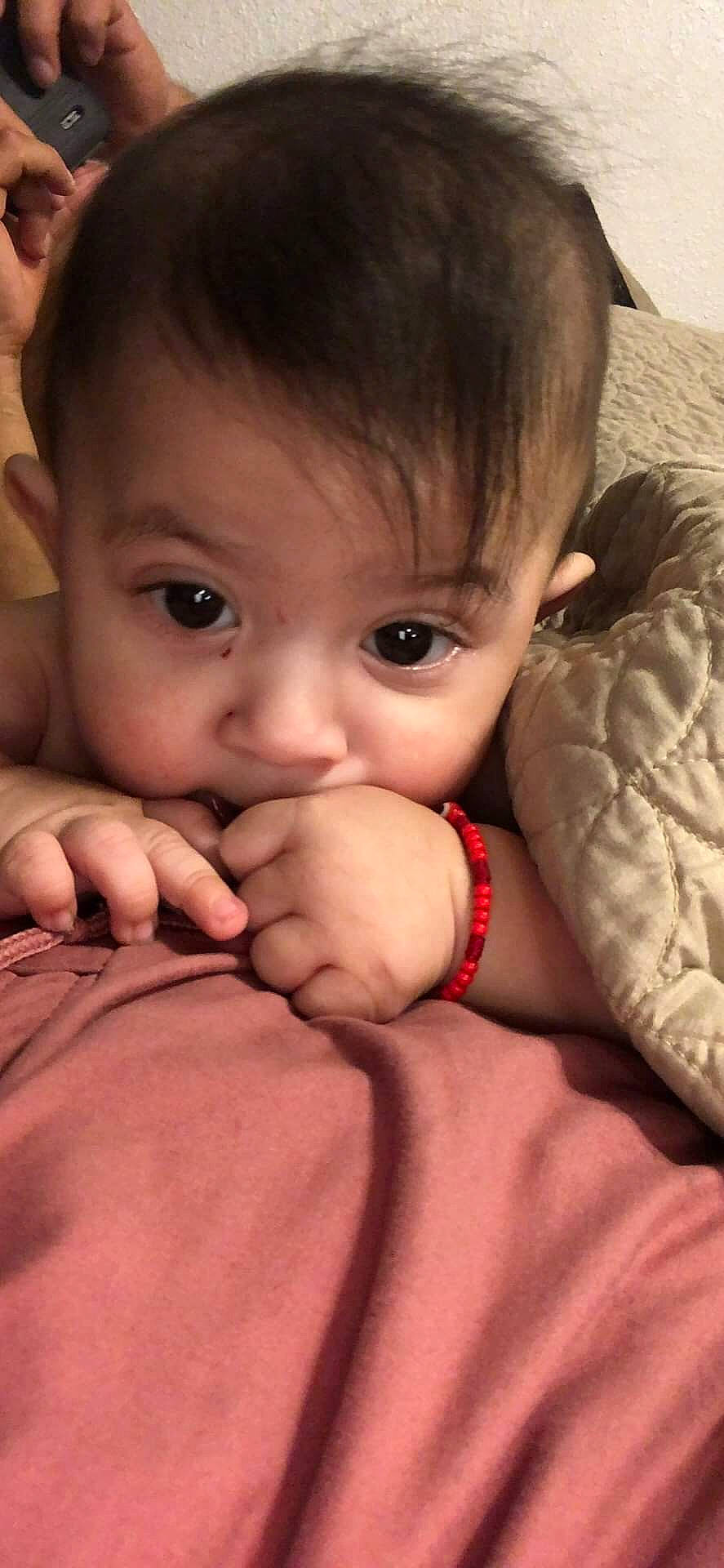 Leonel is registered to the contest to win money with this photo: baby, brown_hair, cheek, child, chin, close_up, eye, face, finger, forehead, gesture, hand, head, lip, mouth, muscle, nose, person, skin, thumb