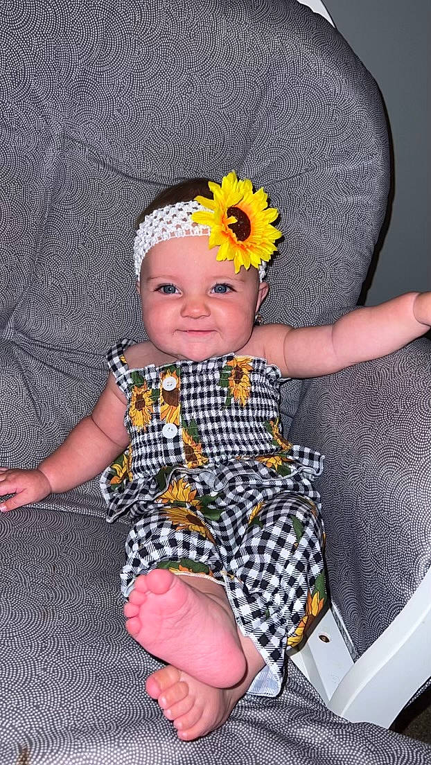 Aubrey joined the competition — help win amazing prizes! baby, baby_toddler_clothing, child, comfort, finger, flower, fun, hairstyle, happy, headband, headgear, headpiece, headwear, joy, pattern, person, pink, product, sleeve, smile