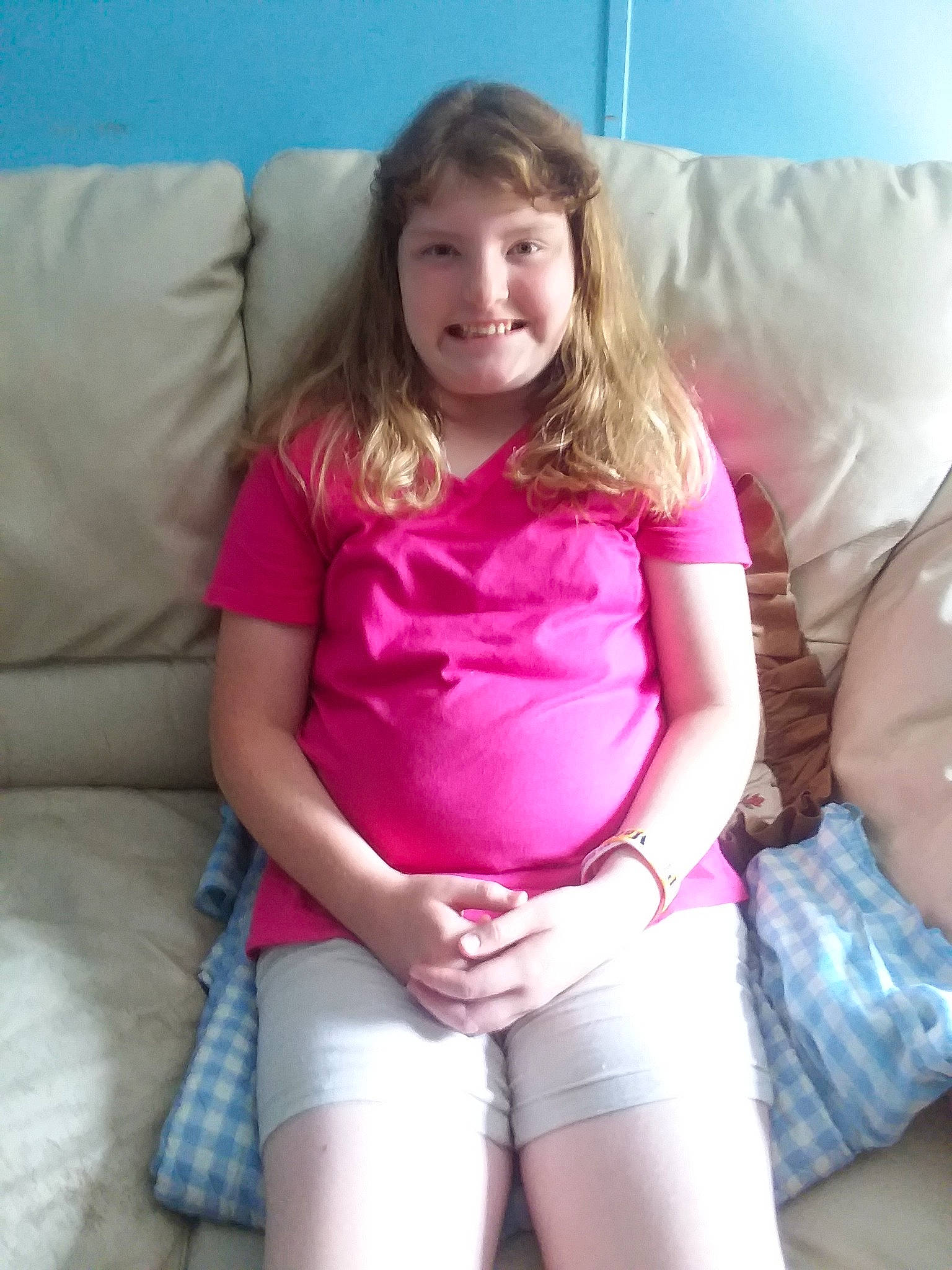 Bethany is registered to the contest to win money with this photo: blond, child, joy, leg, neck, person, pink, sitting, thigh