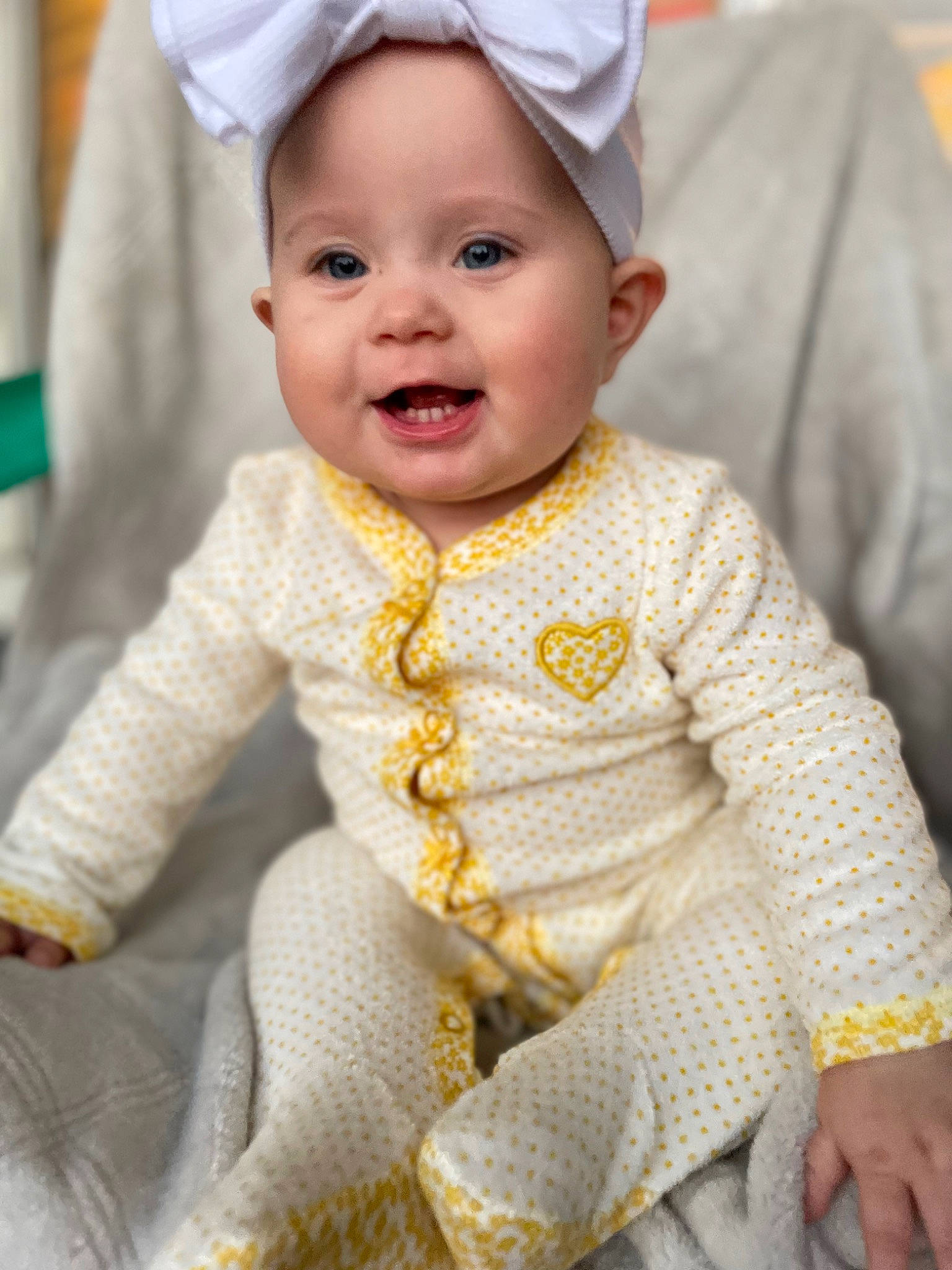 Dahlia joined the competition — help win amazing prizes! baby, baby_toddler_clothing, blue, cheek, dress, eye, face, facial_expression, happy, head, headgear, iris, outerwear, person, photograph, skin, sleeve, smile, t_shirt, toddler