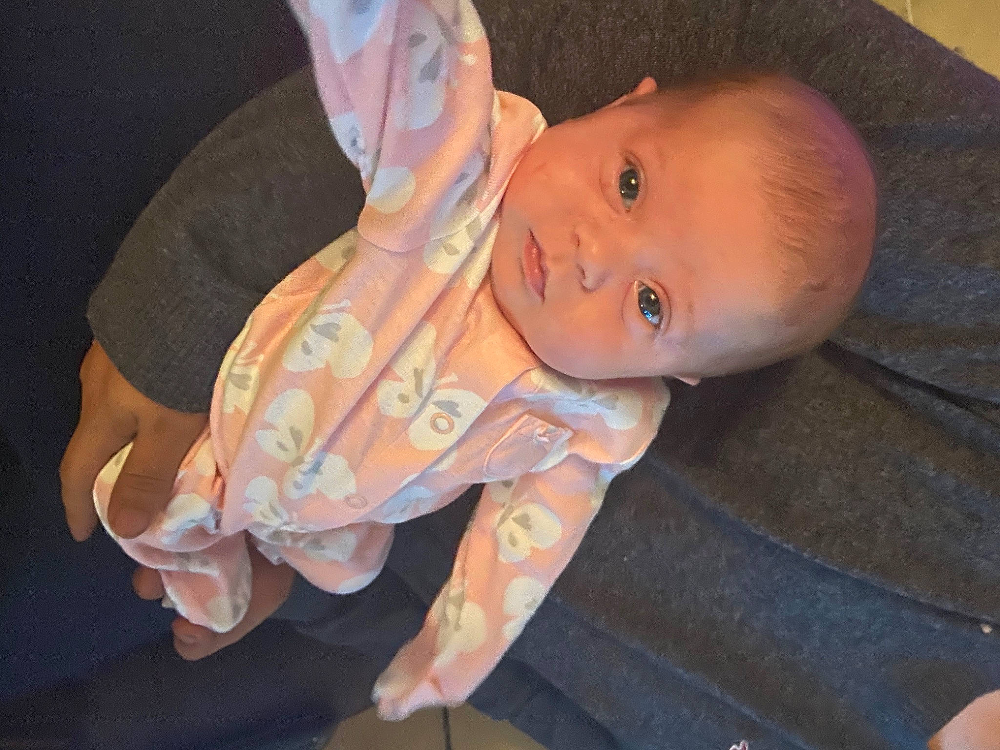 Dahlia is registered to the contest to win money with this photo: baby, baby_products, baby_toddler_clothing, cheek, ear, event, fashion_accessory, finger, fun, gesture, hand, happy, iris, lip, nail, nose, person, sitting, smile, thumb