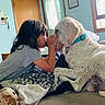 Kobe joined the competition — help win amazing prizes! child, dog, indoor, bed, blanket, window, door, light, curtain, collar, furniture, floor, human, pet, interaction, love, cozy, rest, animal, comfort