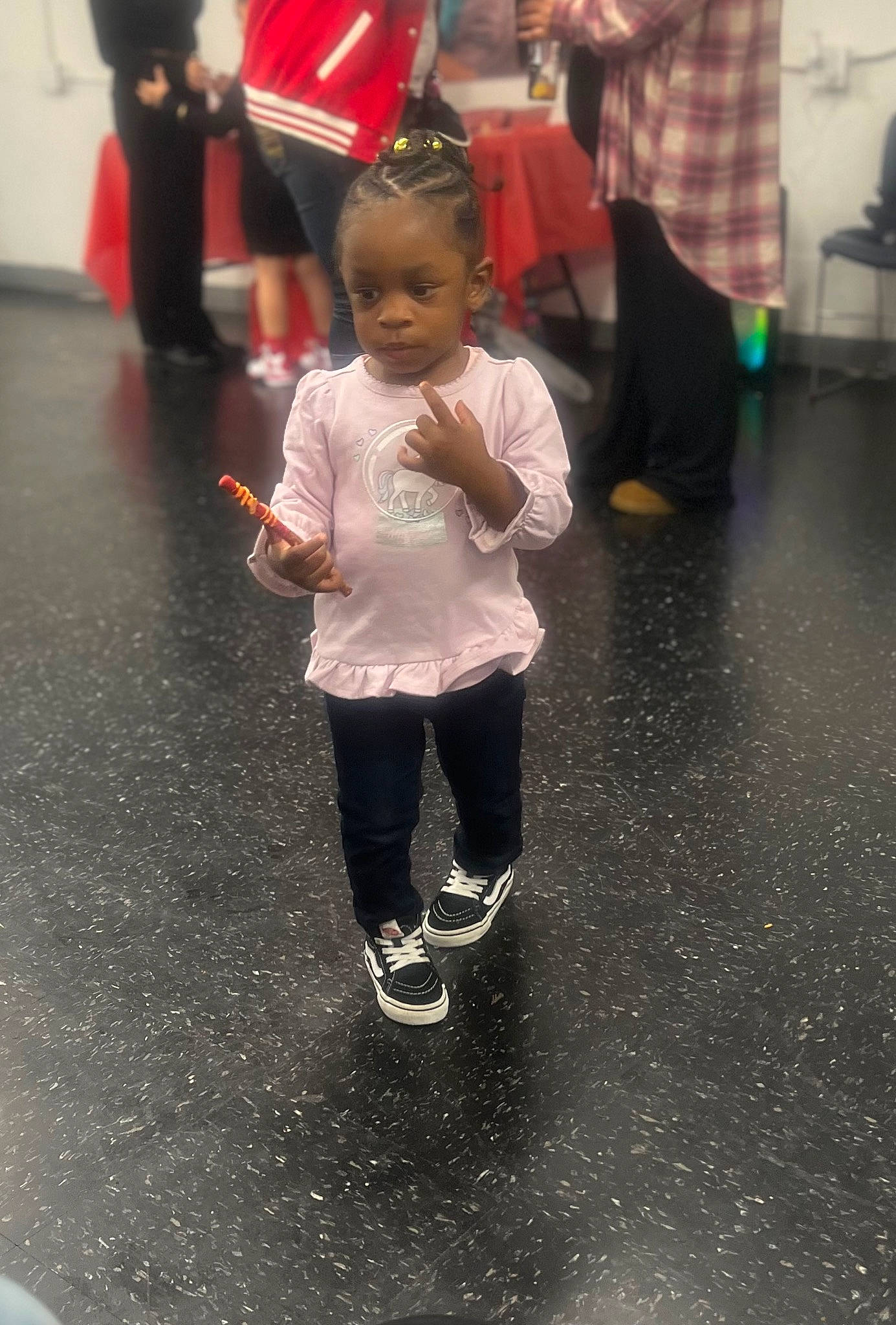 Aniyah is registered to the contest to win money with this photo: asphalt, black, boot, child, event, floor, flooring, fun, hat, leisure, luggage_and_bags, people, person, recreation, road_surface, shoe, sleeve, snapshot, sneakers, standing