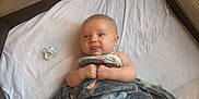 Chase joined the competition — help win amazing prizes! baby, blanket, pacifier, playpen, mesh, infant, lying_down, white_sheet, cozy, child, soft_texture, wrapped, indoor, cute, small_hands, nursery, resting, looking_away, relaxed, comfort