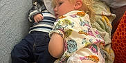 Thomas Brock is registered to the contest to win money with this photo: toddler, baby, child, couch, blanket, clothing, shoes, pacifier, denim, striped_shirt, hand, person, indoor, family, snuggling, cute, relaxing, comfort, casual, resting