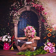 Fiaza is registered to the contest to win money with this photo: artistic, baby, background, child, colorful, cute, decor, floral_arrangement, flower_crown, flowers, garden_theme, greenery, happy, indoor, pink_flowers, portrait, props, smiling, toddler, transparent_tub