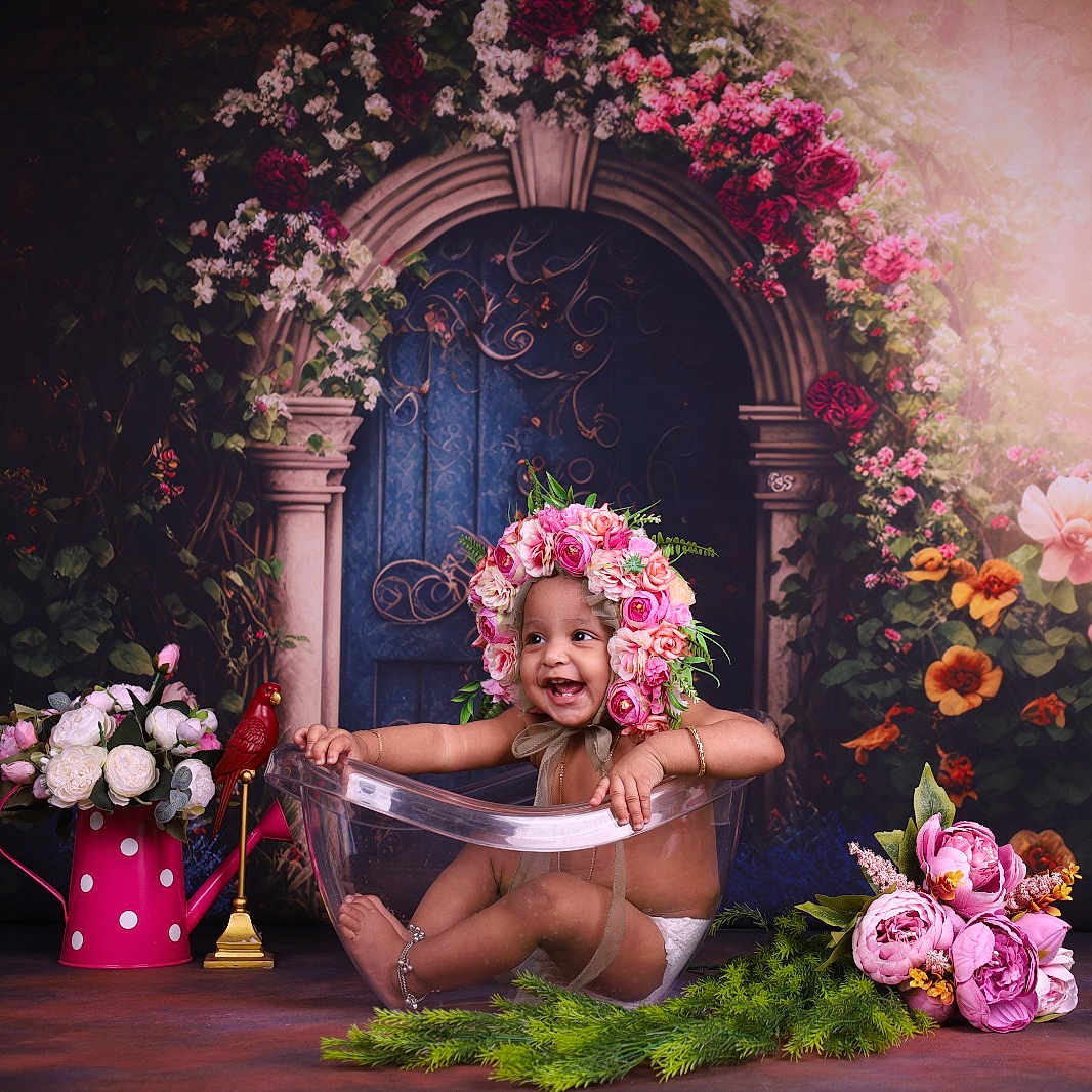 Fiaza is registered to the contest to win money with this photo: artistic, baby, background, child, colorful, cute, decor, floral_arrangement, flower_crown, flowers, garden_theme, greenery, happy, indoor, pink_flowers, portrait, props, smiling, toddler, transparent_tub