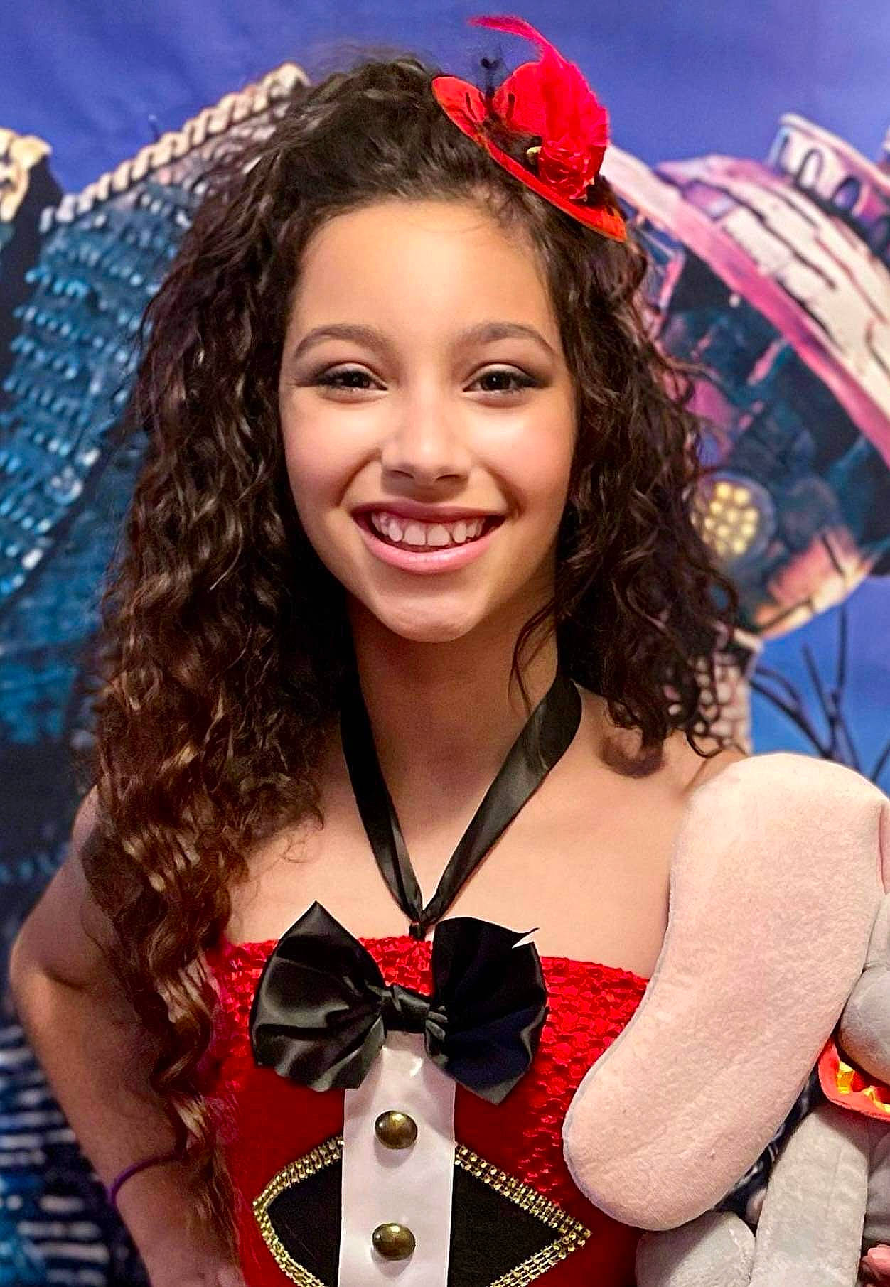 Audriana is registered to the contest to win money with this photo: abdomen, beauty, black_hair, bow_tie, carmine, cool, costume, entertainment, event, fashion_accessory, fun, happy, jewellery, joy, leisure, necklace, pattern, person, red, smile