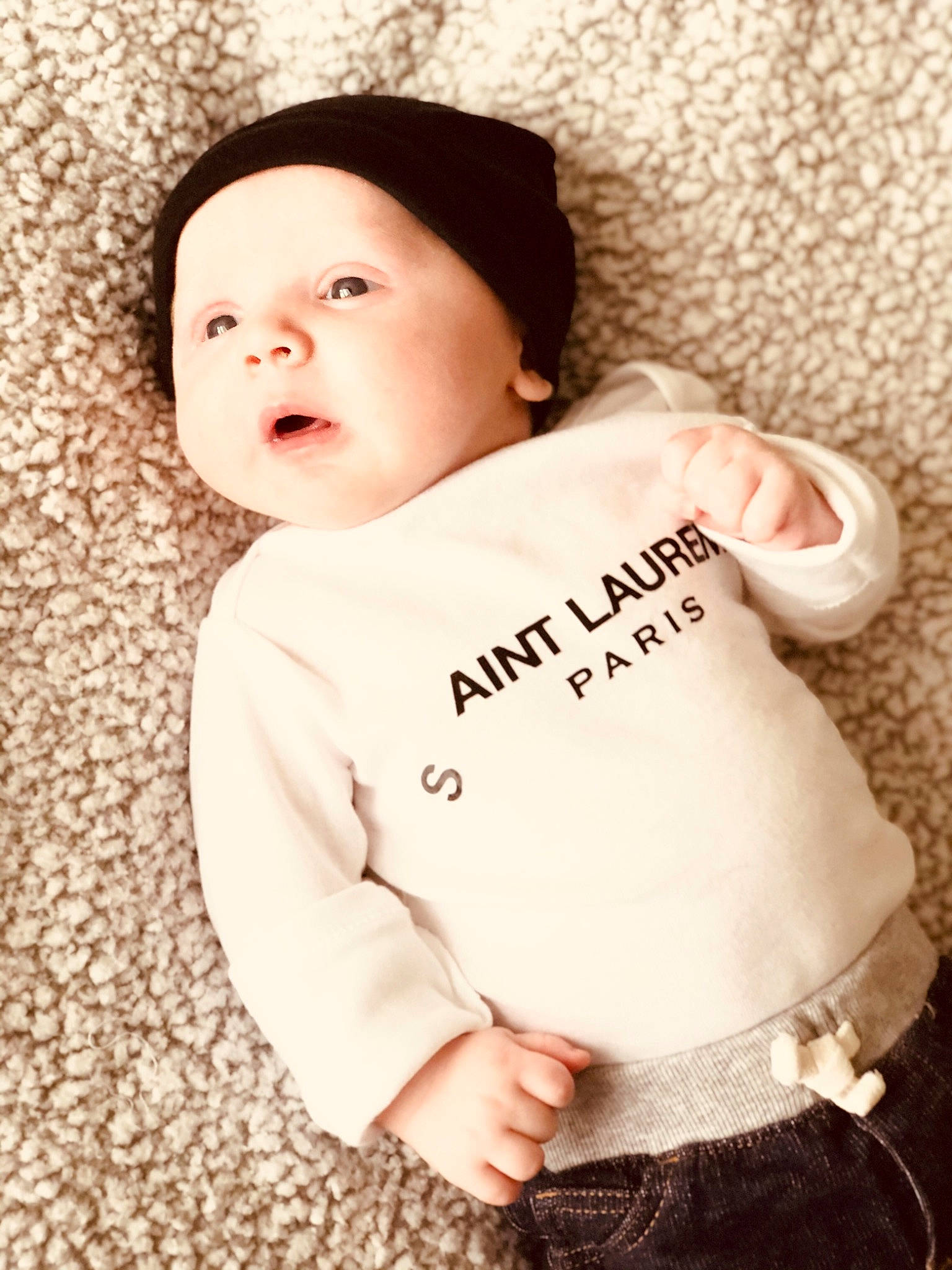 Landon joined the competition — help win amazing prizes! baby, baby_toddler_clothing, cap, cheek, child, comfort, font, fur, happy, headwear, hood, lip, pattern, peach, person, portrait_photography, skin, sleeve, t_shirt, toddler