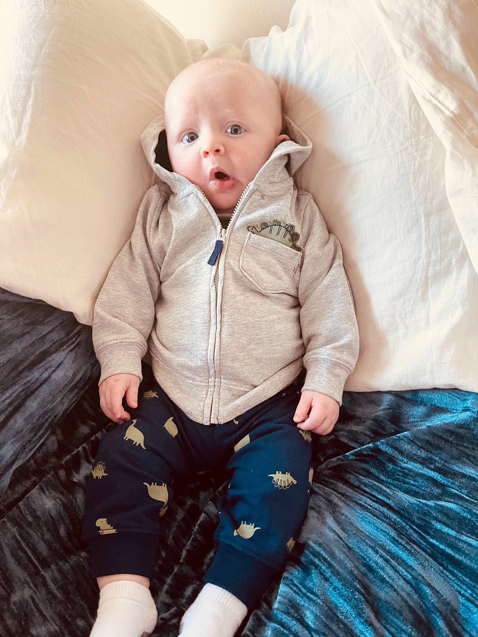 Landon is registered to the contest to win money with this photo: baby, baby_sleeping, baby_toddler_clothing, child, comfort, fun, fur, happy, human_leg, iris, linens, outerwear, pattern, person, product, sitting, skin, sleeve, surprise, textile