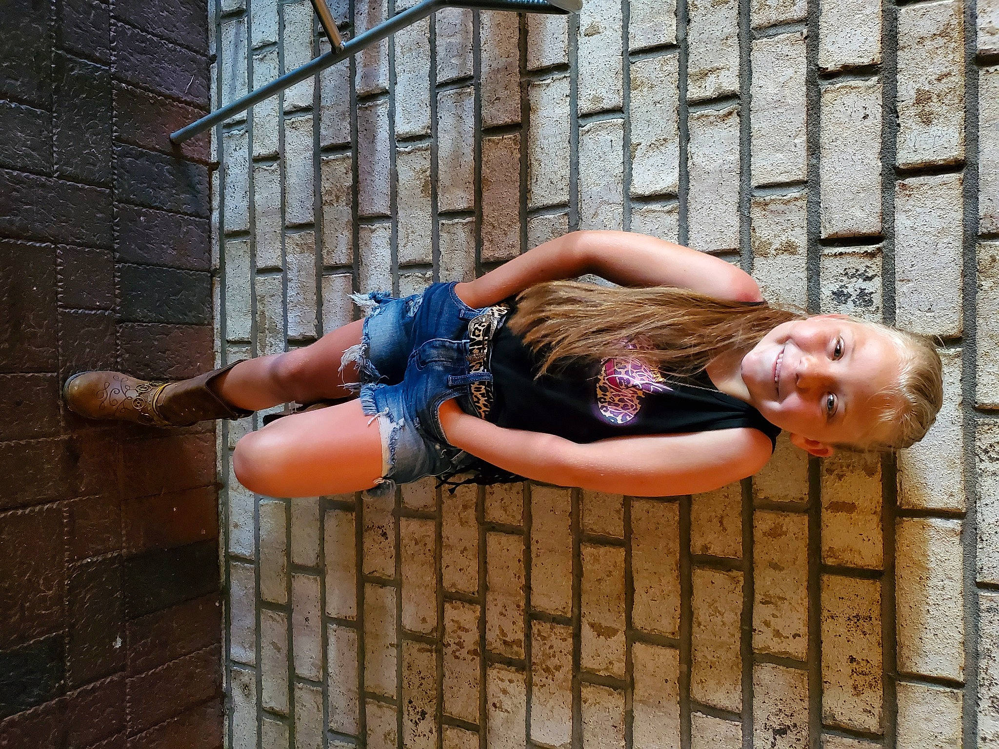 Delaney joined the competition — help win amazing prizes! arm, blond, brick, brickwork, dress, elbow, flash_photography, hand, happy, human_leg, jeans, joint, joy, knee, leg, leisure, person, sitting, street_fashion, thigh
