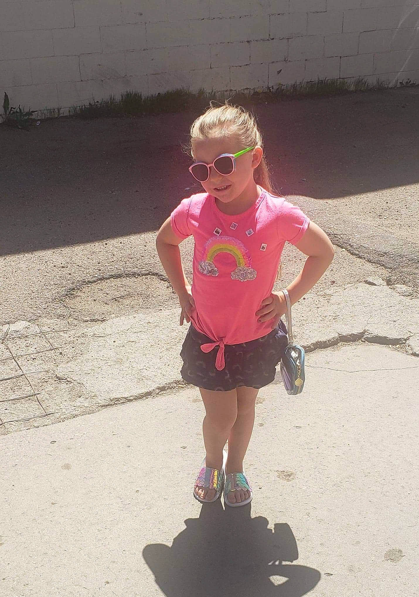 Delaney joined the competition — help win amazing prizes! asphalt, child, cool, eyewear, footwear, fun, glasses, person, pink, play, recreation, shadow, shoe, shorts, summer, sunglasses, toddler, vacation
