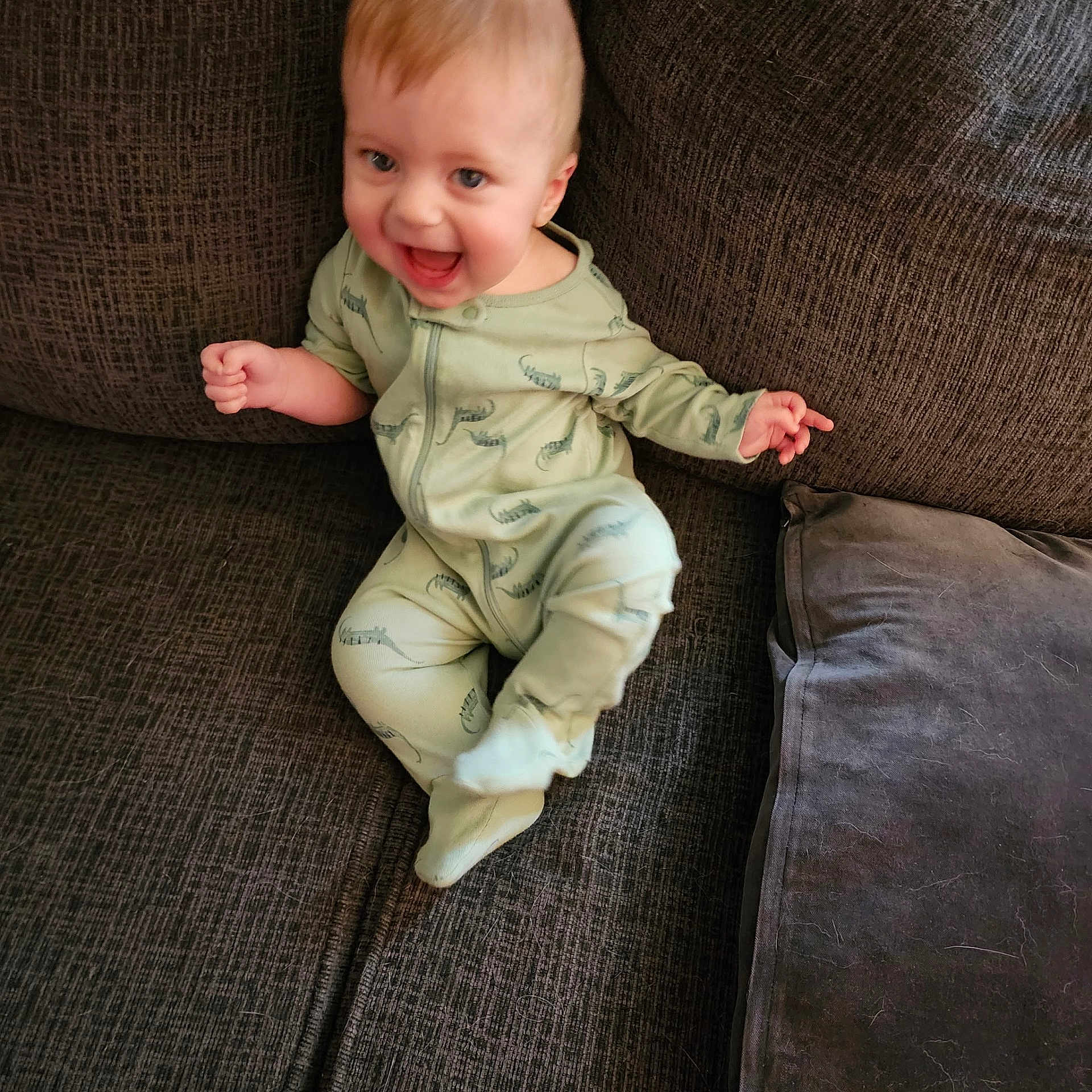 Deacon joined the competition — help win amazing prizes! baby, bodypart, chair, clothing, couch, cushion, face, finger, furniture, hand, happy, head, homedecor, pajamas, pants, person, photography, portrait, sitting, smile