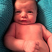 Ashtyn is registered to the contest to win money with this photo: baby, infant, skin, face, eyes, hand, arm, blanket, knitwear, expression, portrait, newborn, cute, child, human, closeup, soft, cozy, lying_down, indoors