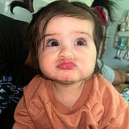 Jhaylani is registered to the contest to win money with this photo: child, toddler, pigtails, pout, face, indoor, cute, expression, person, clothing, long_eyelashes, brown_eyes, hair, sweater, baby, skin, portrait, funny_face, closeup, young