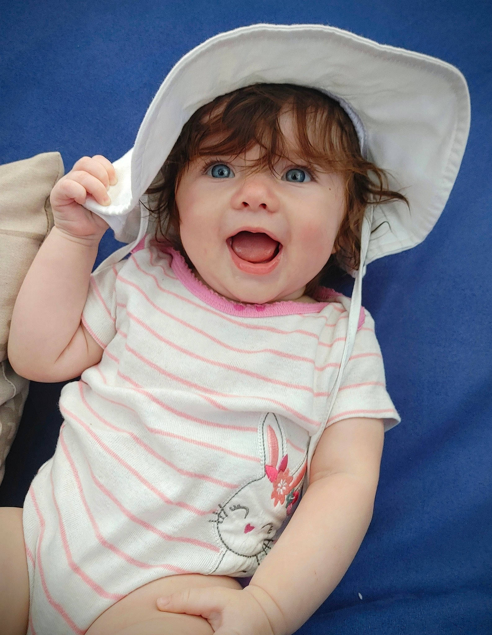 Kaitlyn is registered to the contest to win money with this photo: arm, baby_toddler_clothing, cheek, chin, eye, eyebrow, face, hair, hand, hat, head, human_body, lip, mouth, neck, nose, person, product, skin, sleeve