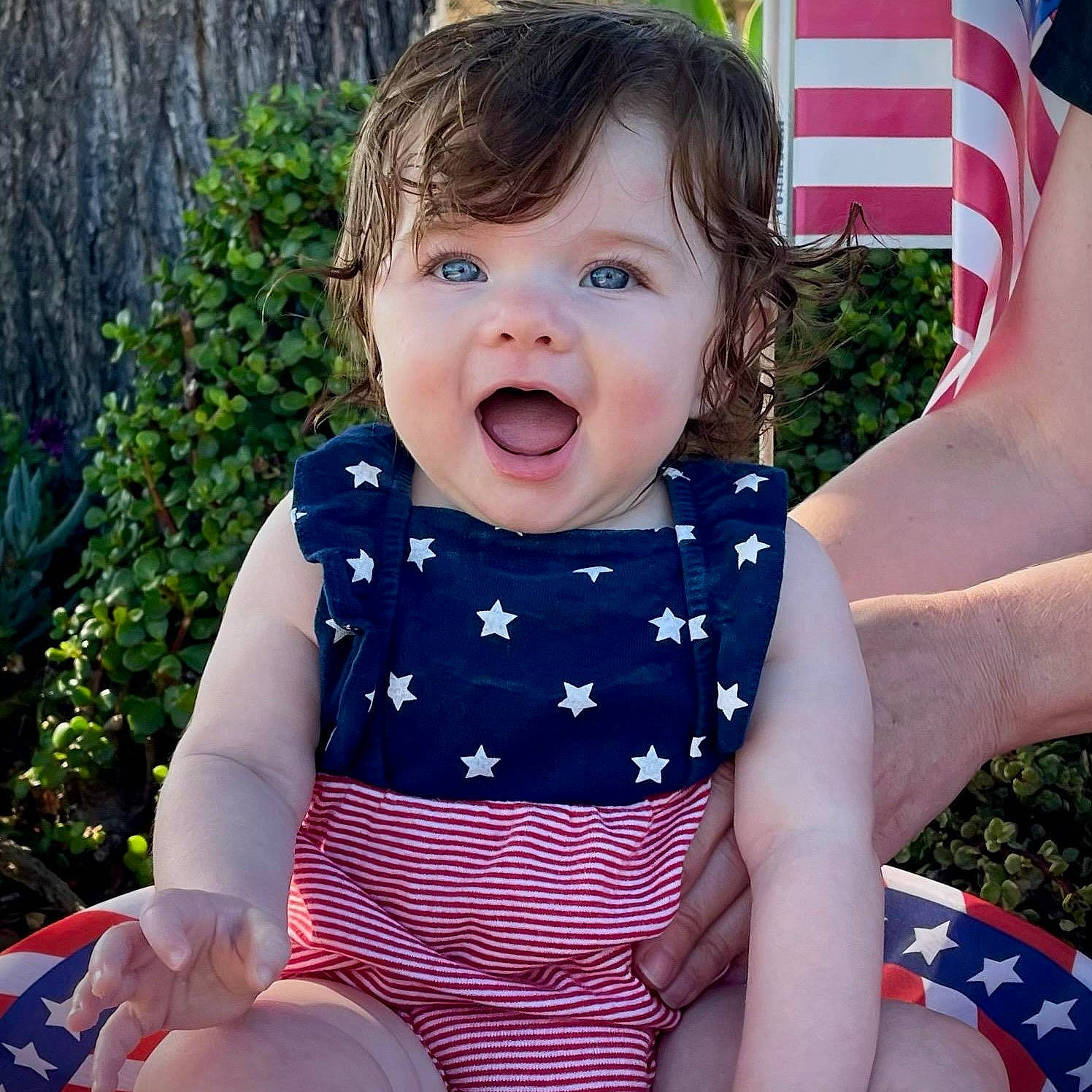 Kaitlyn is registered to the contest to win money with this photo: baby, baby_toddler_clothing, cool, finger, fun, gesture, grass, happy, lip, neck, people_in_nature, person, pink, plant, product, skin, sleeve, smile, standing, textile