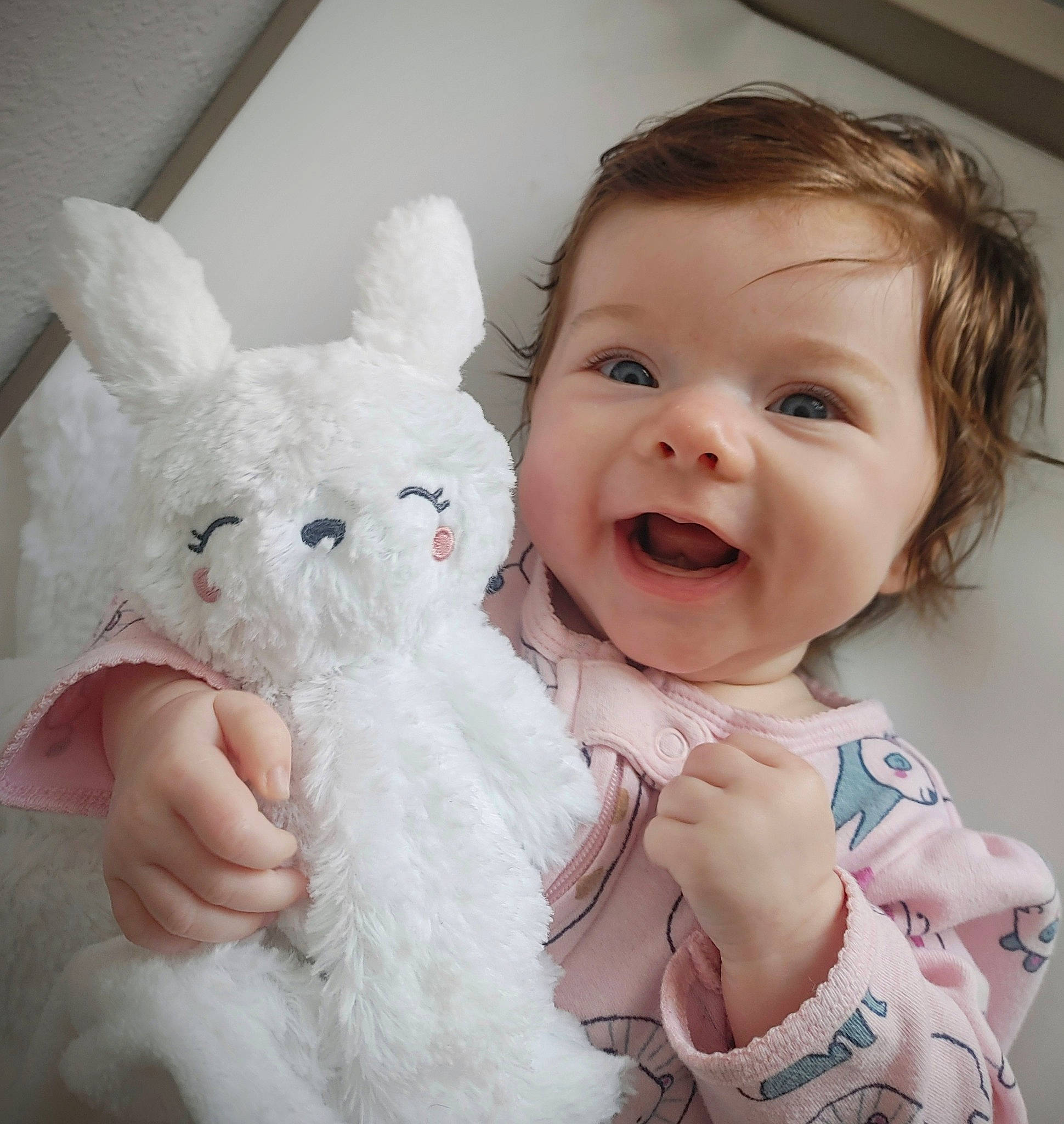 Kaitlyn joined the competition — help win amazing prizes! baby_toddler_clothing, ear, eye, facial_expression, felidae, gesture, hand, happy, head, human_body, iris, nose, organ, person, pink, product, rabbit, skin, smile, textile