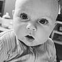 baby, black_and_white, child, closeup, curious, cute, expression, eyes, face, head, indoor, infant, person, portrait, ribbed_clothing, sitting, soft_light, young, young_child, zipper