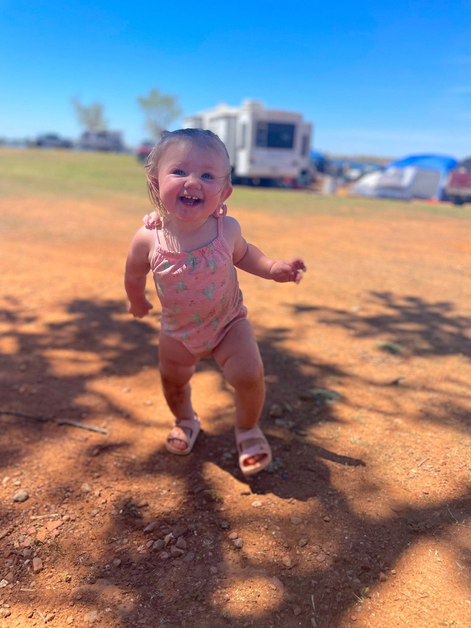 Haylee is registered to the contest to win money with this photo: baby, beach, body_of_water, finger, flash_photography, fun, grass, happy, hat, horizon, landscape, leisure, mammal, people_in_nature, people_on_beach, person, sand, sky, sunlight, toddler
