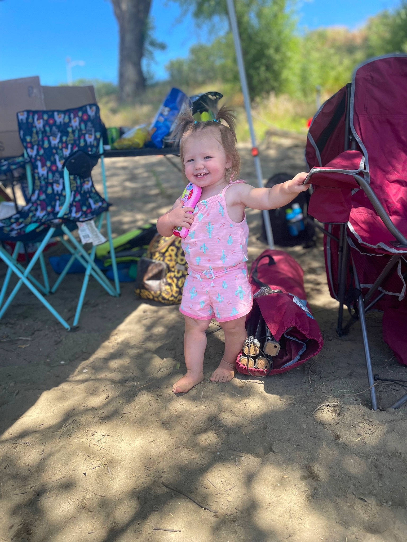 Haylee joined the competition — help win amazing prizes! baby, chair, child, event, foot, fun, grass, happy, head, joy, leaf, leisure, magenta, outdoor_furniture, person, plant, public_space, recreation, sandal, sky