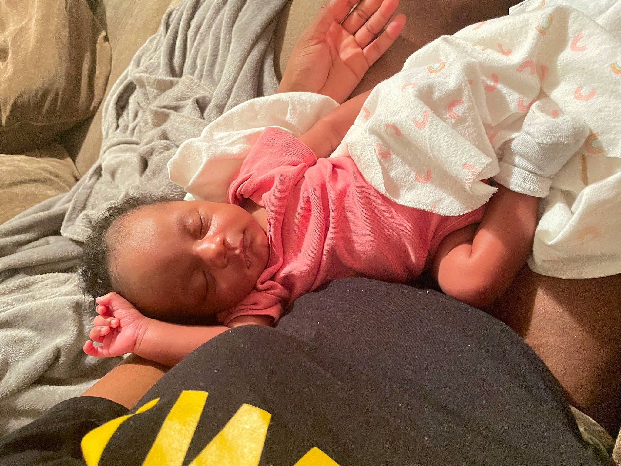 Niyah is registered to the contest to win money with this photo: baby, baby_toddler_clothing, bed, bedding, bedtime, child, comfort, facial_expression, finger, foot, gesture, grass, head, human_leg, linens, muscle, person, skin, t_shirt, textile