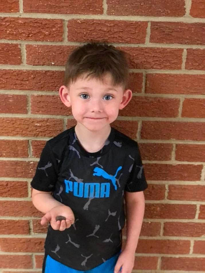 Camryn is registered to the contest to win money with this photo: active_shirt, baby_toddler_clothing, brick, brickwork, cheek, child, electric_blue, face, fun, happy, head, human_body, joy, neck, pattern, person, sleeve, smile, sportswear, t_shirt