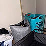 Ghost is registered to the contest to win money with this photo: cat, black_cat, laundry_basket, clothes, laundry, indoor, pet, feline, eyes, peeking, container, fabric, home, household, floor, carpet, corner, plastic_basket, gray, blue