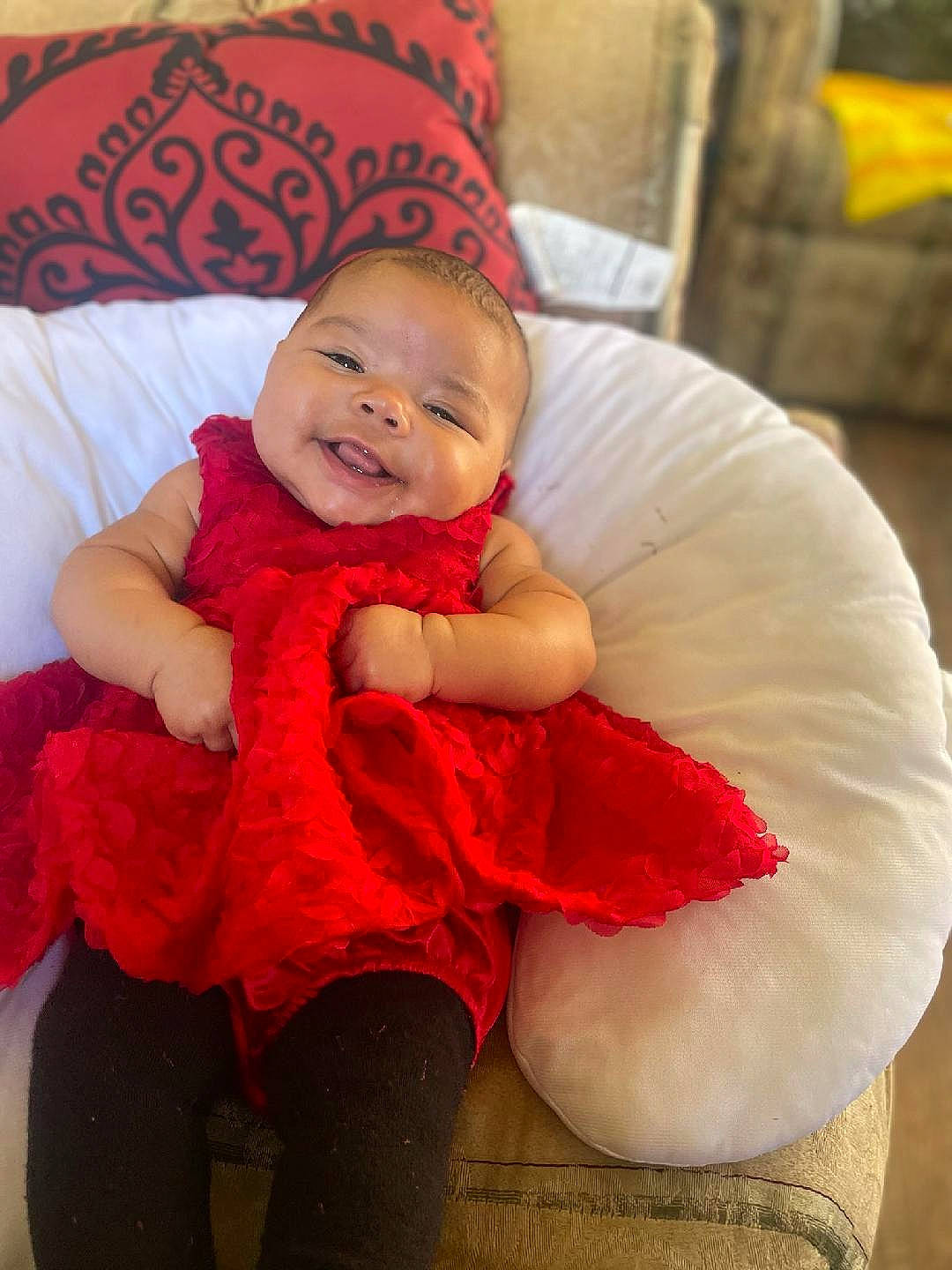 Emerie joined the competition — help win amazing prizes! baby, baby_toddler_clothing, child, comfort, couch, finger, fun, happy, human_leg, lap, leg, person, pink, red, sitting, skin, smile, sock, standing, toddler