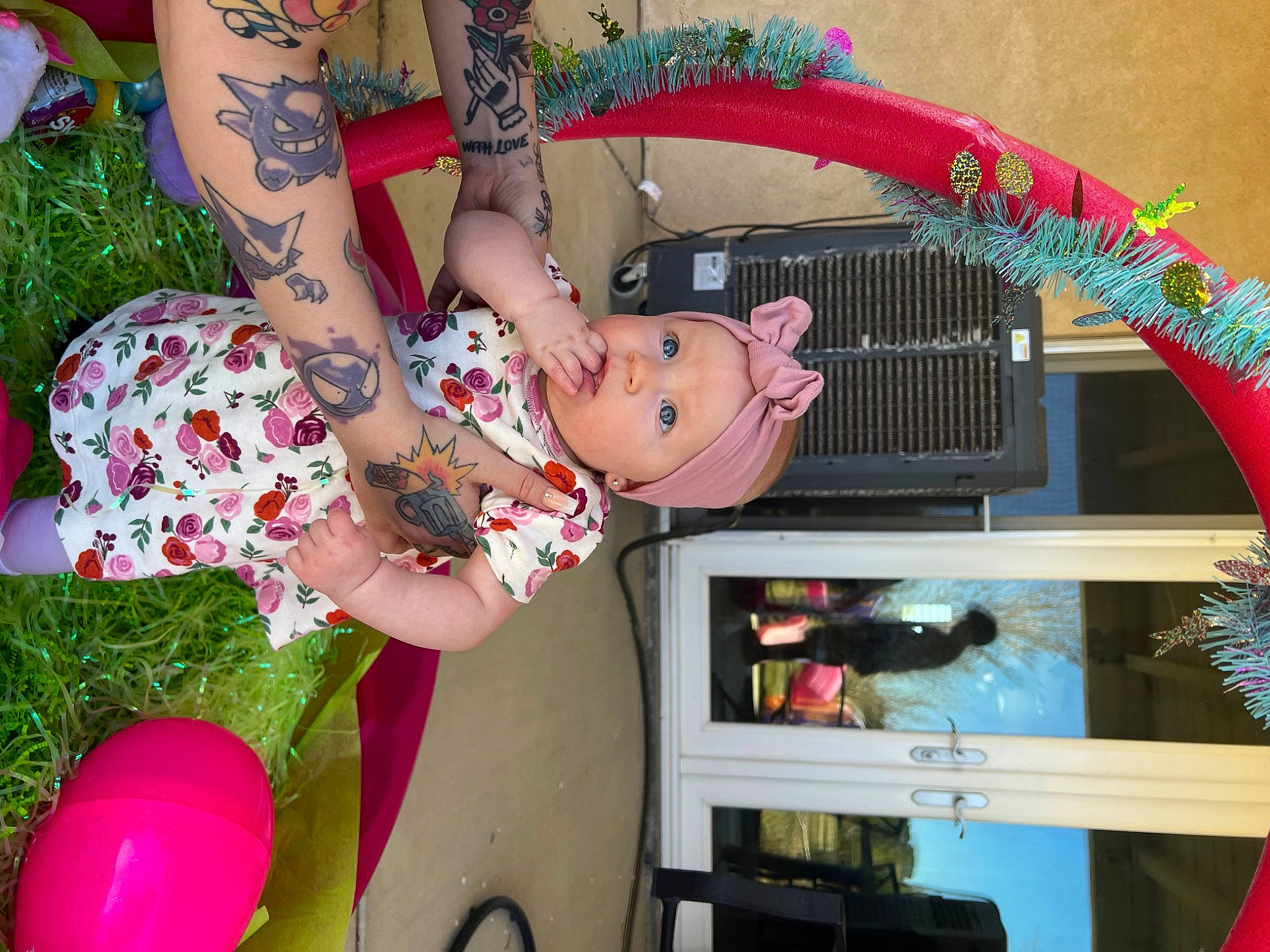 Harlee is registered to the contest to win money with this photo: abdomen, arm, child, event, fun, grass, happy, headwear, human_leg, magenta, party_supply, pattern, person, photography, pink, plant, sandal, textile, thigh, toddler