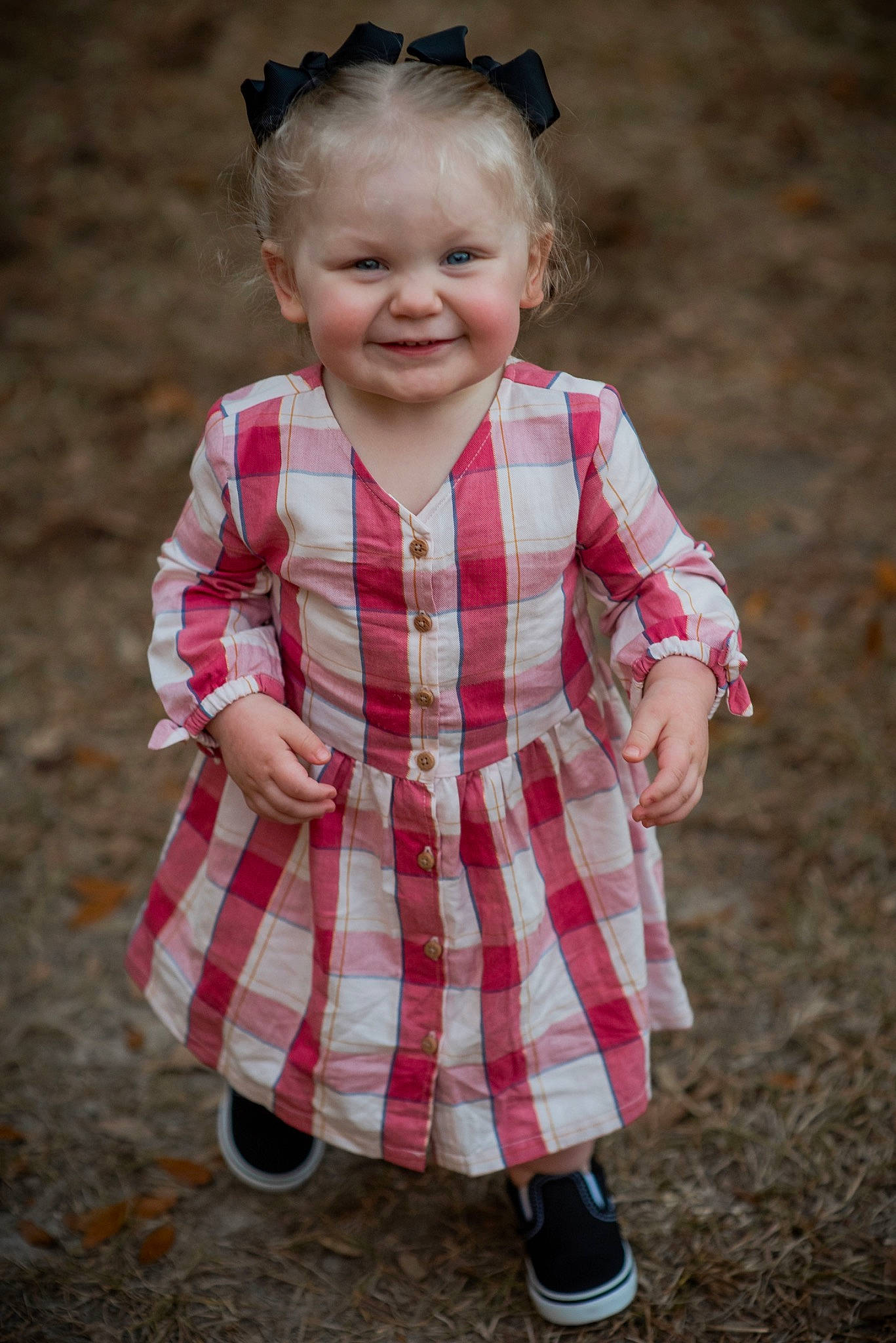 Kennedy is registered to the contest to win money with this photo: baby_toddler_clothing, beauty, child, day_dress, dress, face, fun, grass, hairstyle, happy, joy, lip, pattern, people, person, pink, plaid, sleeve, smile, tartan