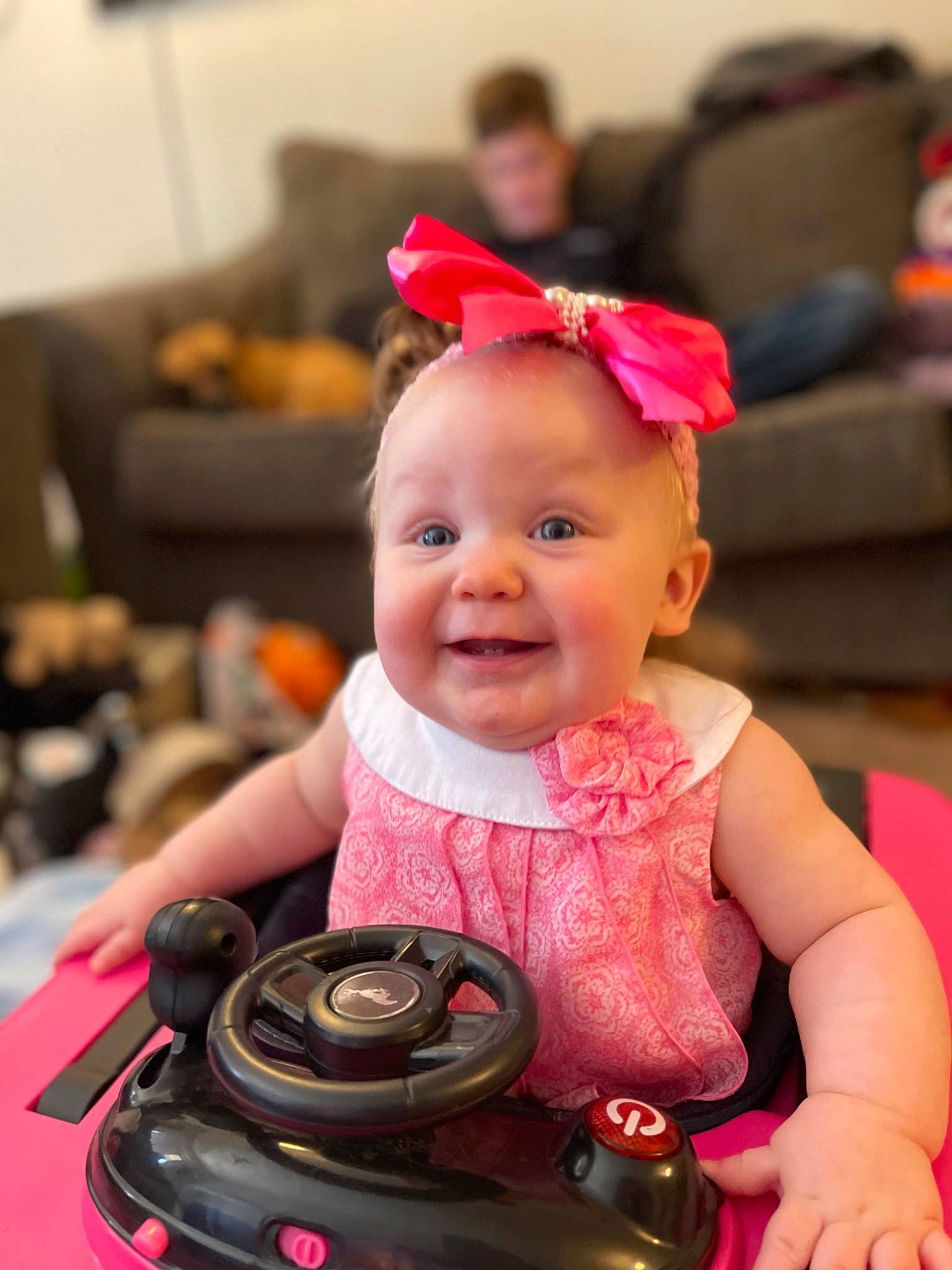 Kennedy joined the competition — help win amazing prizes! automotive_design, baby, baby_toddler_clothing, blurred, camera, camera_lens, digital_camera, eye, fun, happy, iris, joy, motor_vehicle, person, pink, red, reflex_camera, skin, smile, tire
