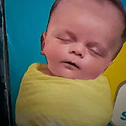 Hayden joined the competition — help win amazing prizes! baby, blanket, child, closed_eyes, colorful_background, cute, face, head, indoor, infant, newborn, peaceful, person, portrait, skin, sleeping, soft, wrapped, yellow, young